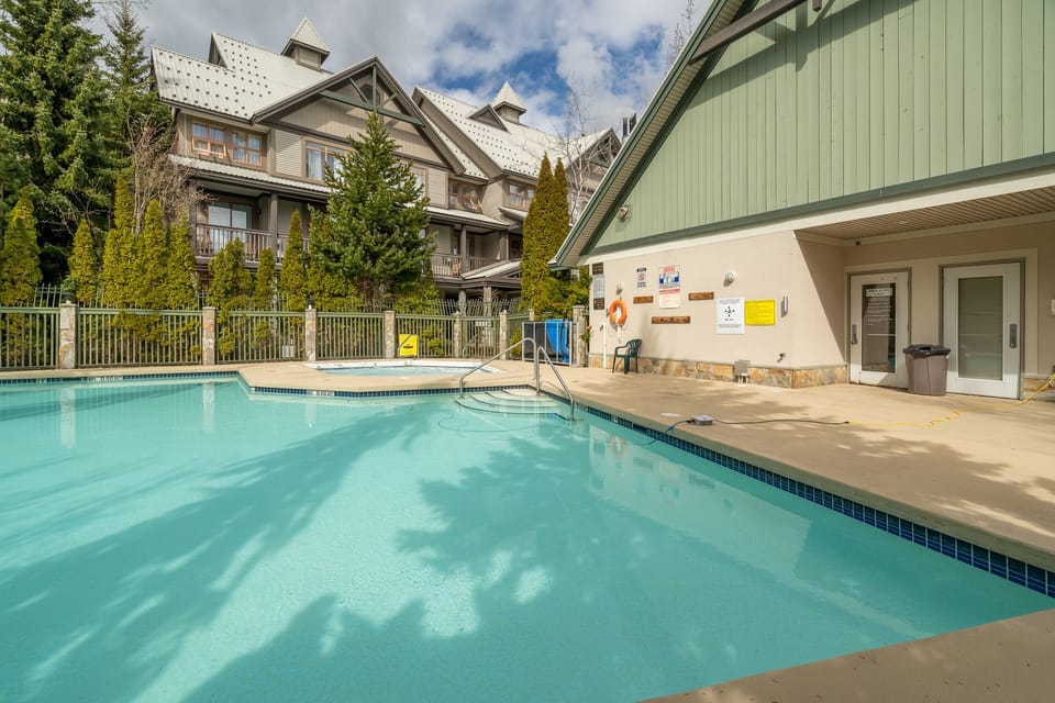 Outdoor heated pool and hot tub. 
