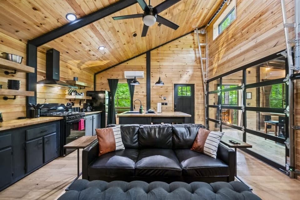 Lounge in comfort on our black leather sofa with the fireplace aglow.