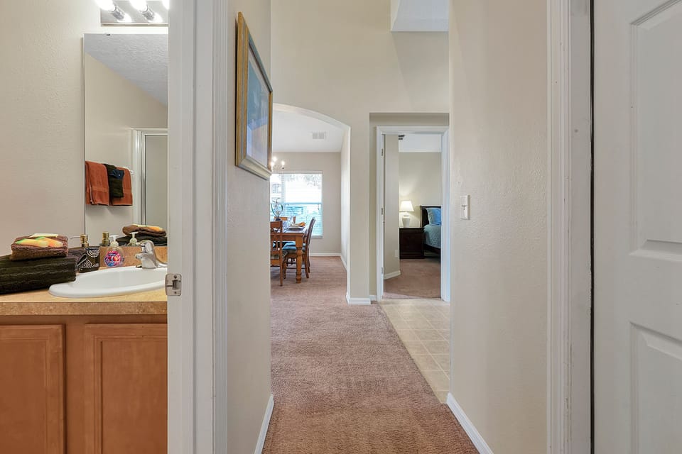 Convenient first-floor layout: full bathroom with a walk-in shower located directly across from the queen bedroom