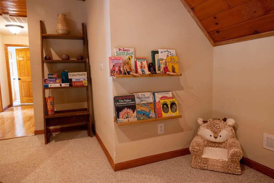 the loft has a place for kids to cosy up and read or play with toys