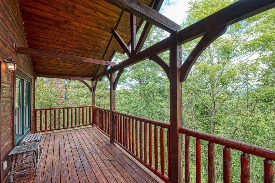 deck with greenery and mountain views