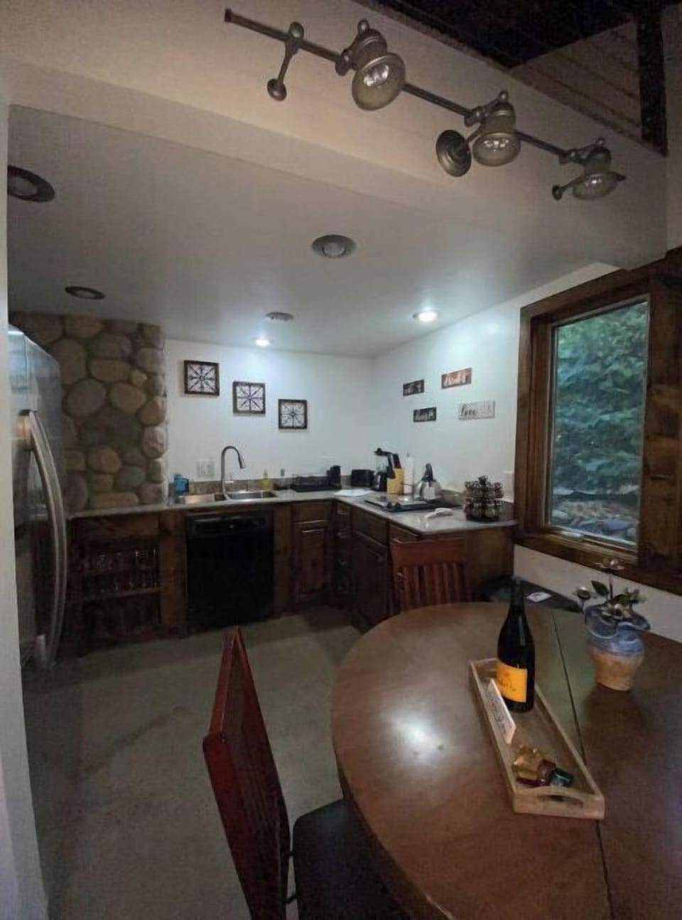Clean and simple kitchen with cookware, spices, and coffee provided