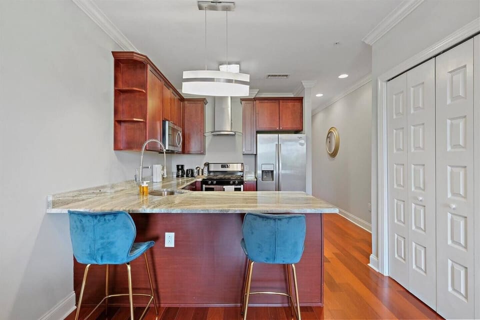 Modern kitchen design with ample counter space and full-size appliances throughout.