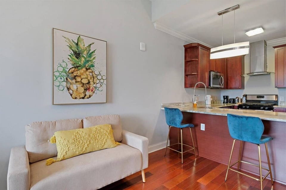 Spacious kitchen island with bar-height seating—perfect for meals or productive work-from-home sessions.