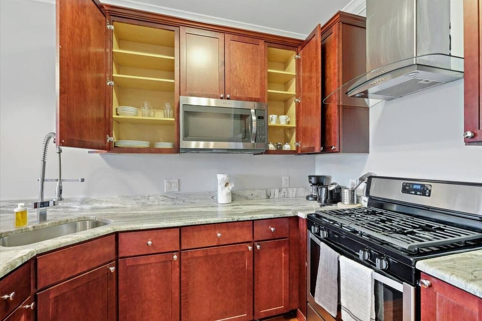 Ample counter space and stylish open shelving for easy meal preparation and storage