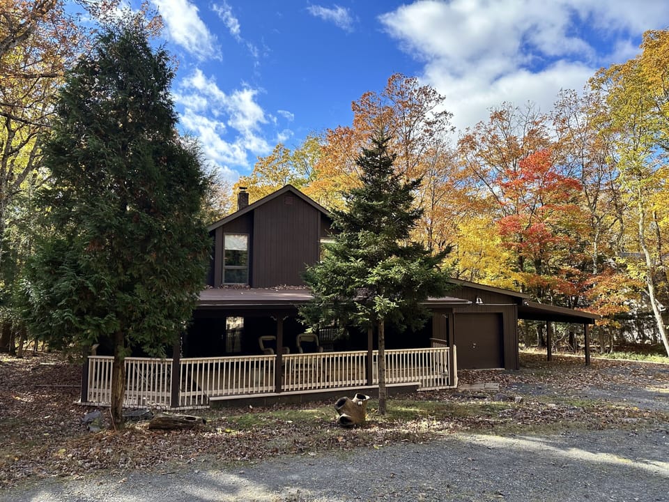 Front of the house with fall foliage