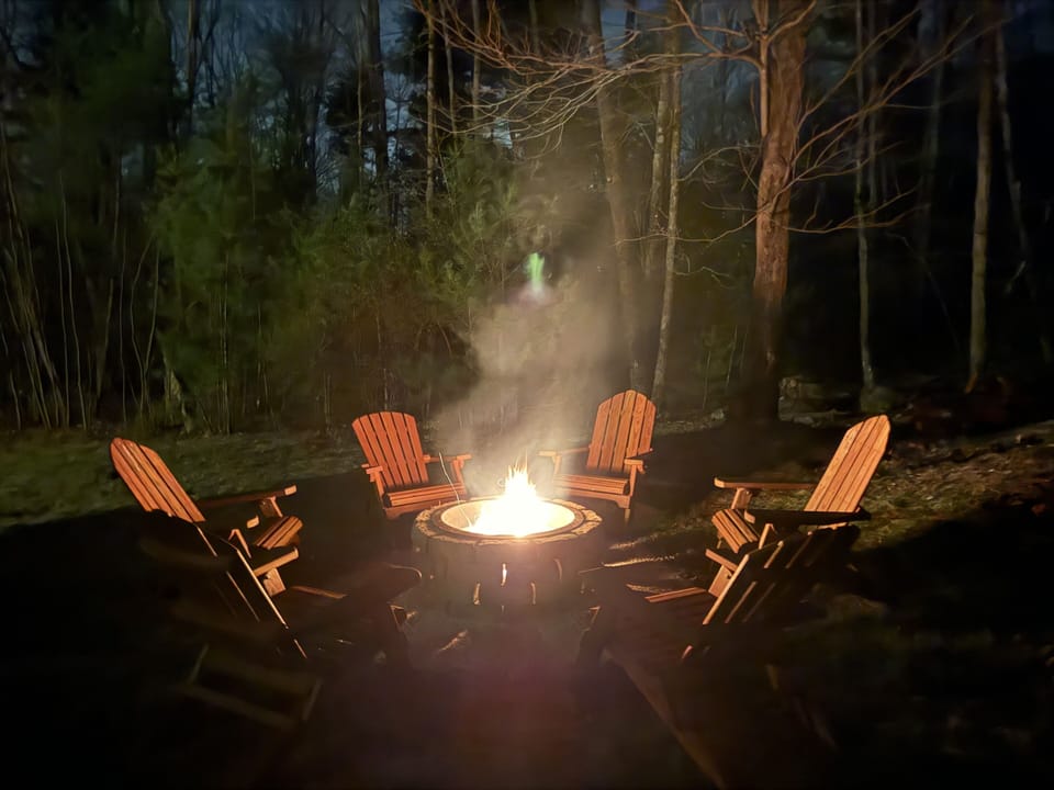 Enjoy our newly constructed firepit with 6 Adirondack chairs