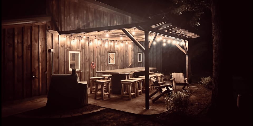Outdoor handmade patio table seats 12! Charcoal grill right on patio