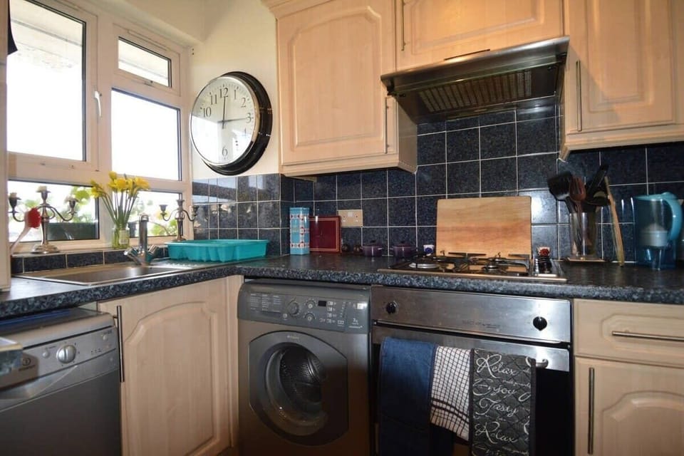 Washing machine. Dishwasher. Oven and gas hob. Microwave. Large fridge freezer.
