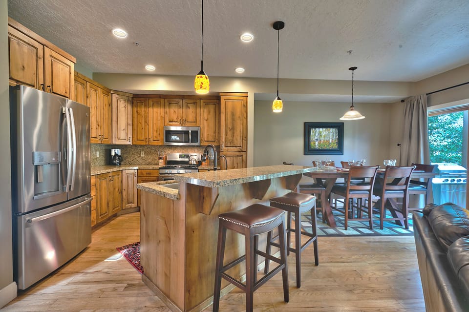 Beautiful kitchen, hardwood floors throughout and wood cabinetry with granite countertops and kitchen island
