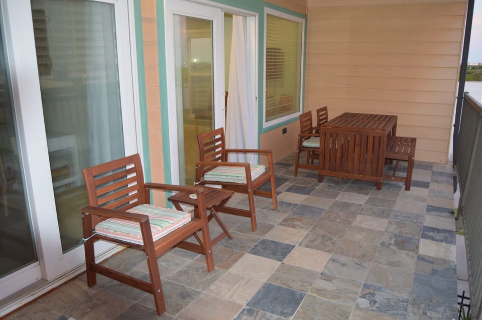 Large balcony with table and plenty of seating for the whole family