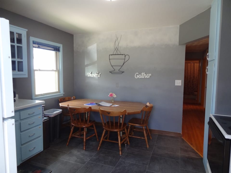 Kitchen with Keurig and regular coffee pot.