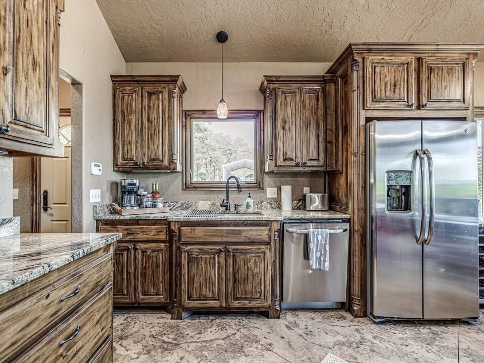 Large sink and dishwasher make clean up after meals quick and easy.