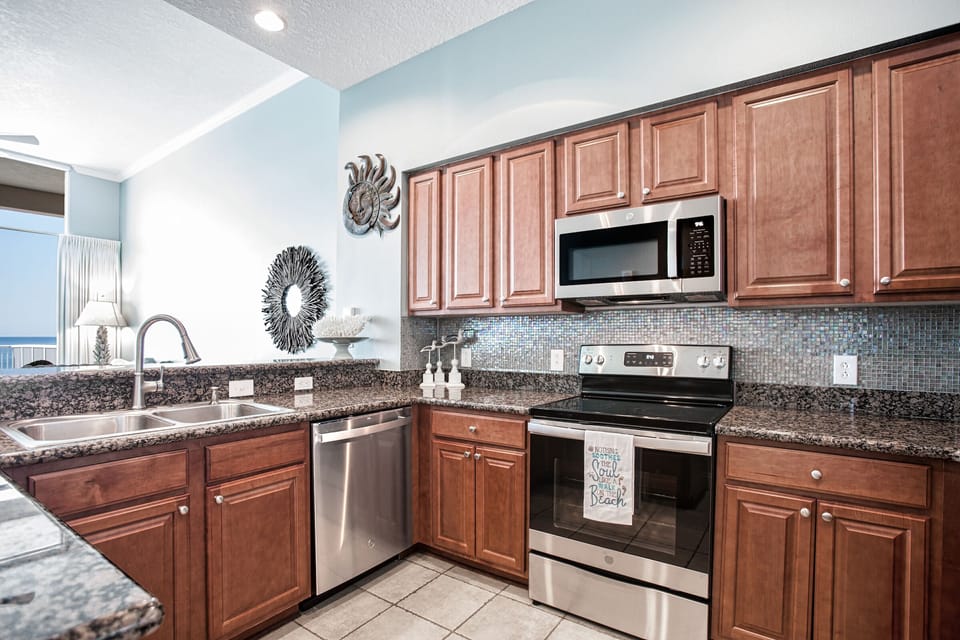 Updated kitchen with stainless appliances and granite counters. 