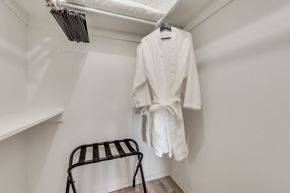 Master walk-in closet & luggage rack. All rooms have luggage racks & closets.