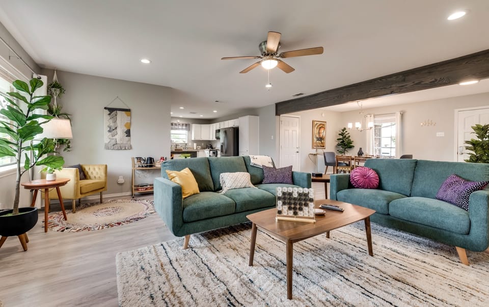 Open concept house, living room, dining area, reading corner and kitchen area
