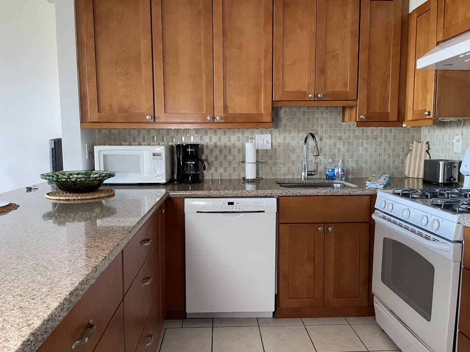 Full kitchen with gas stove, refrigerator, dishwasher and microwave. 