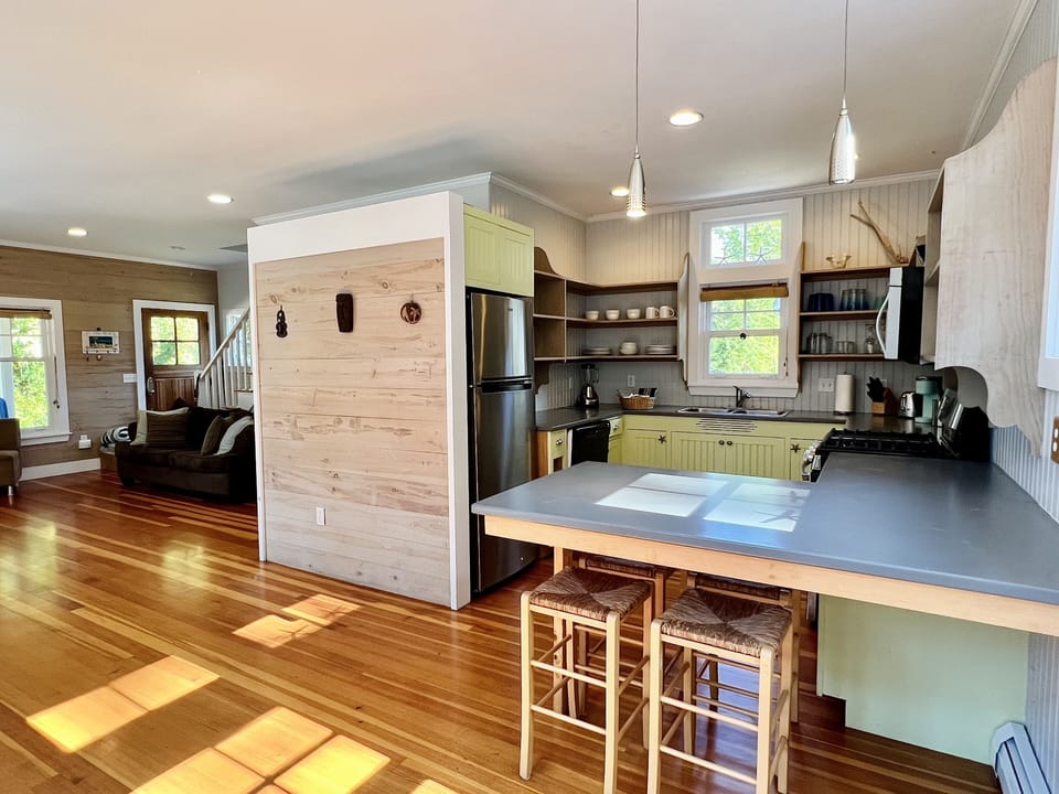 Open concept kitchen w/all your cooking needs and shelving w/breakfast bar 