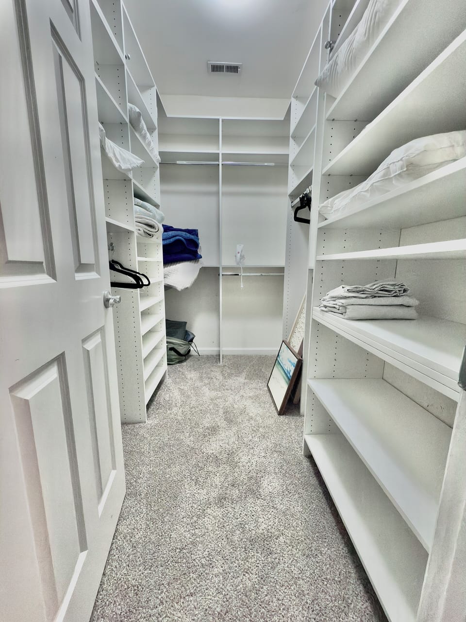 Large master bedroom closet with plenty of storage
