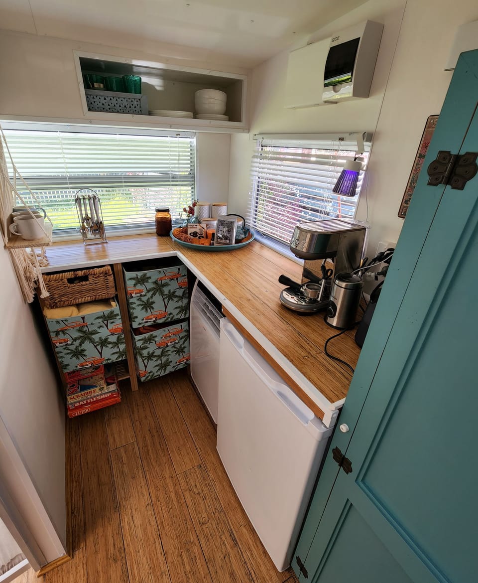 The internal kitchenette features tea and coffee making, microwave & more