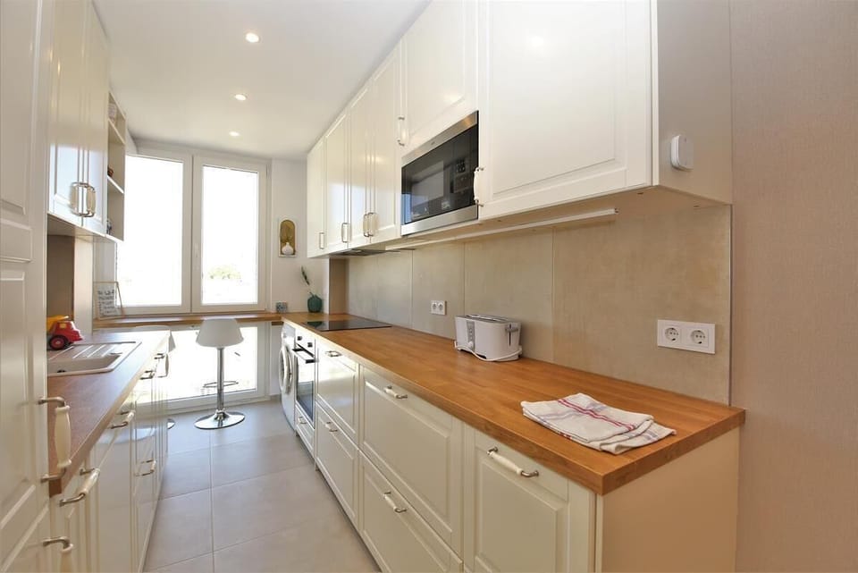 Huge open kitchen is fully equipped with all the appliances