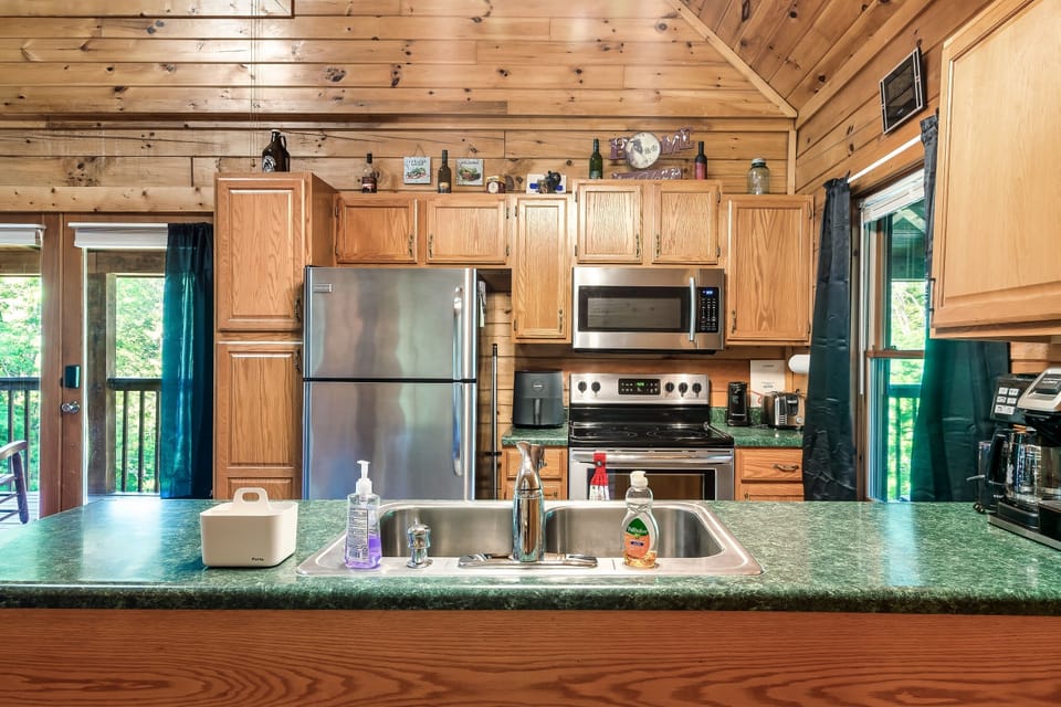 Stainless appliances, freezer has ice maker, Brita filter in fridge for water.