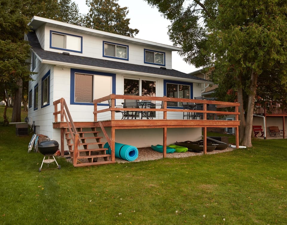 View of the cottage from the water. Kayaks, water mat and grill are included