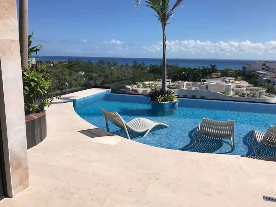 Shared rooftop pool overlooking the ocean