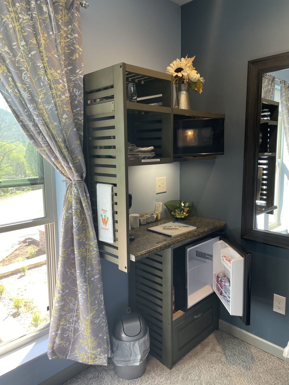 Kitchenette offers a mini-fridge, microwave, coffee maker & dinnerware for two.