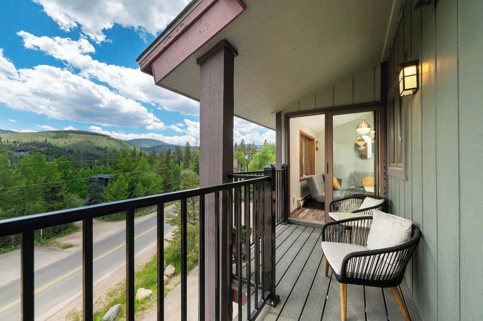 Balcony by kitchen and outside of primary suite