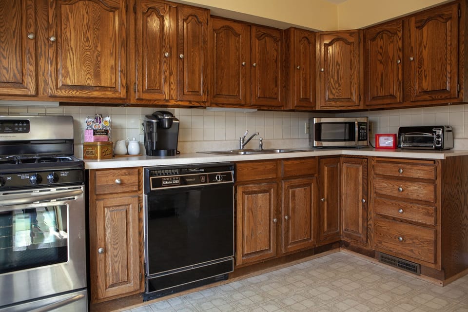 Full kitchen complete with dishes, pots and pans, etc.
