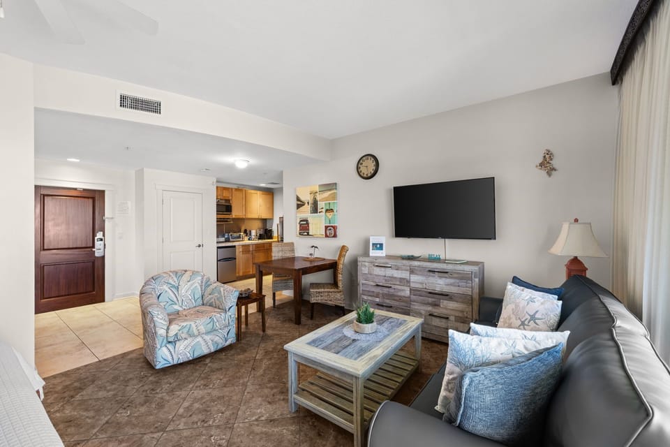 Your coastal-inspired retreat awaits, blending beachy blues and driftwood tones with modern comfort. Relax in this airy space where the kitchen, dining, and living areas flow seamlessly together.