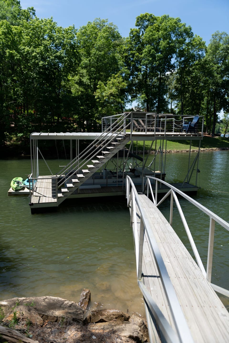 Two story dock with swim ladder, kayaks, and cleats on the side for your boat!