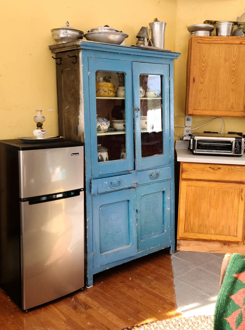 Frig, Air Fryer and propane stove top. Dishes, pots and pans provided 