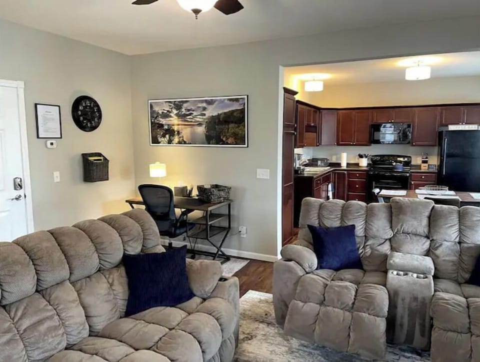 Downstairs open-concept living room #1.  Reclining sofas with USB ports/lights.