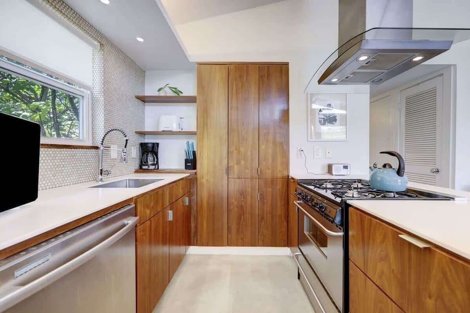 The beautiful wood finishes in the kitchen create a warm environment for cooking and gathering.