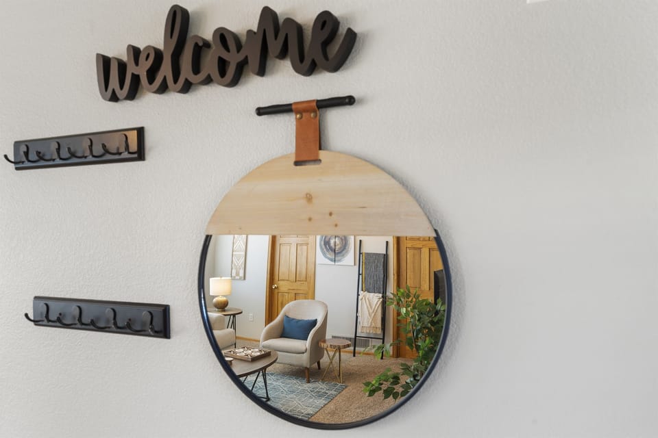 Entryway: Welcome home! Stylish decor meets comfort in this inviting space. Perfect for your getaway!