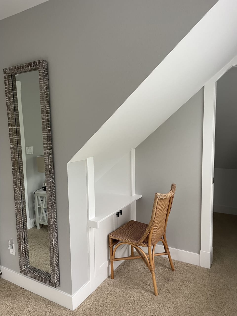 Upper level bedroom has a desk