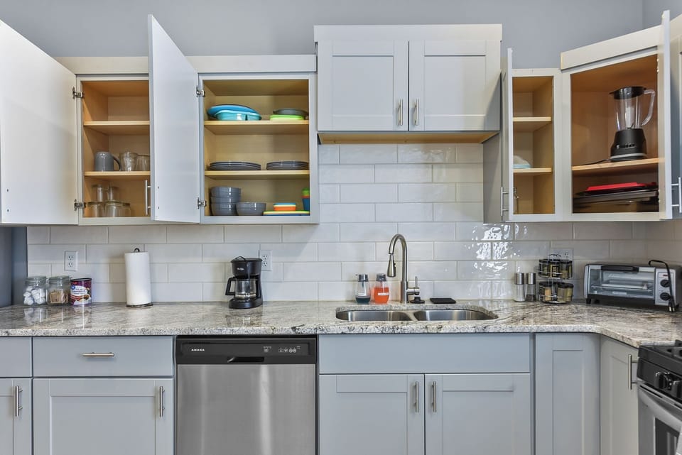 Kitchen With Stove Microwave, Toaster, and Dishwasher