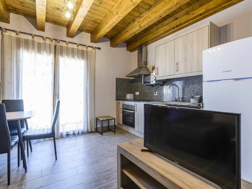 Cabinetry, Furniture, Countertop, Table, Building, Wood, Kitchen Stove, Kitchen Appliance, Curtain, Kitchen