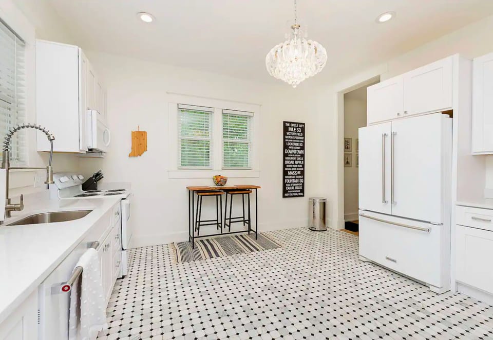Sit and Eat a Quick Meal or Snack at the Table in the Kitchen, Set for Two. 
