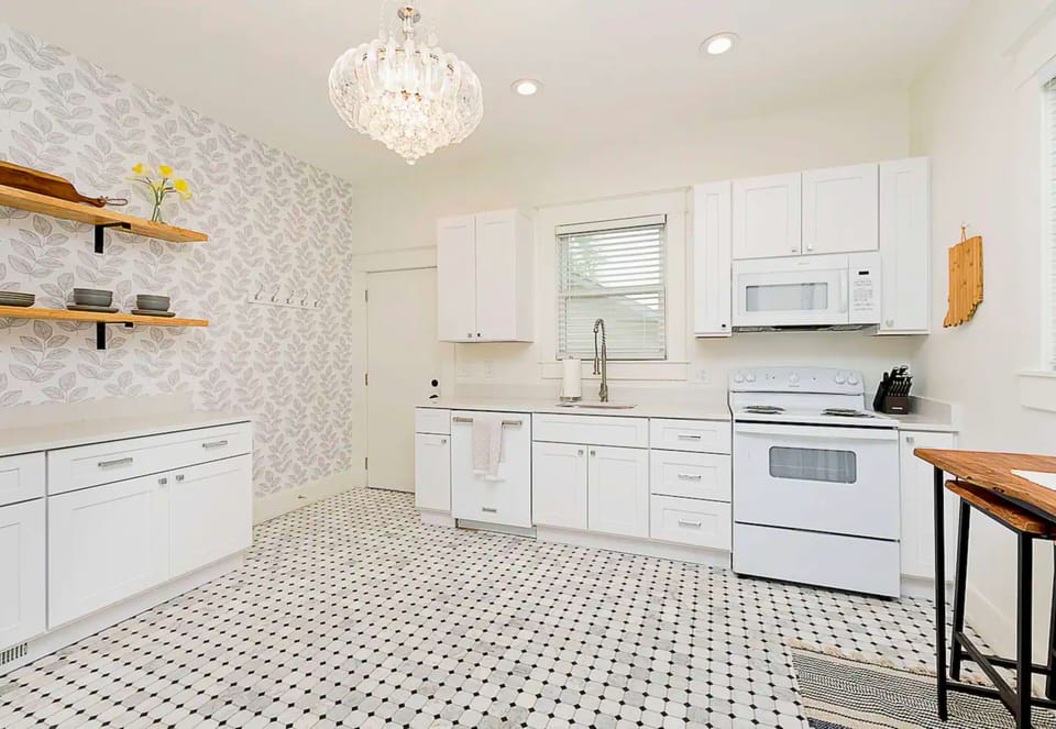 The Kitchen is Spacious, has an Electric Range, Dishwasher, Fridge and Microwave