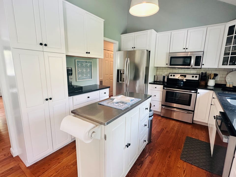 Kitchen is open to the neighboring dining area - 671 Great Fields Rd Brewster Cape Cod - Beach Glass - New England Vacation Rentals