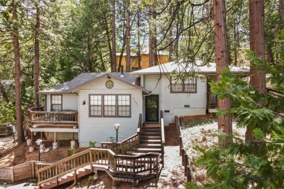Quaint mountain cabin nestled in the trees. 