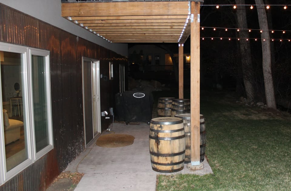 Back porch provides a grill and beautiful spot to enjoy an evening by the water. 