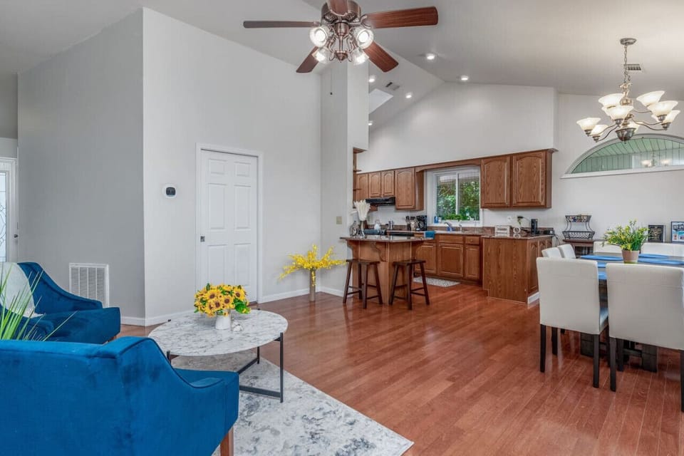 Spacious open-concept kitchen and living area with plenty of seating, natural light, and inviting charm.