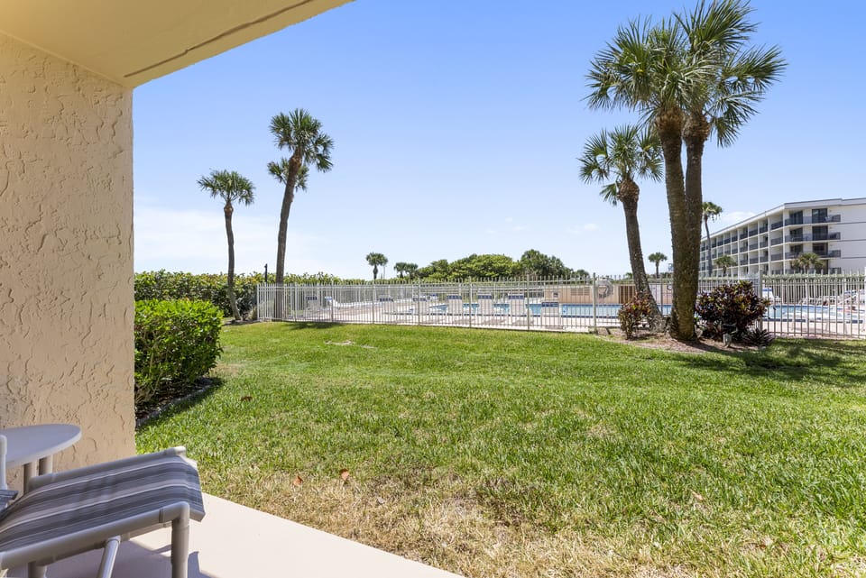 Ground-floor patio with easy access to the beach and pool.