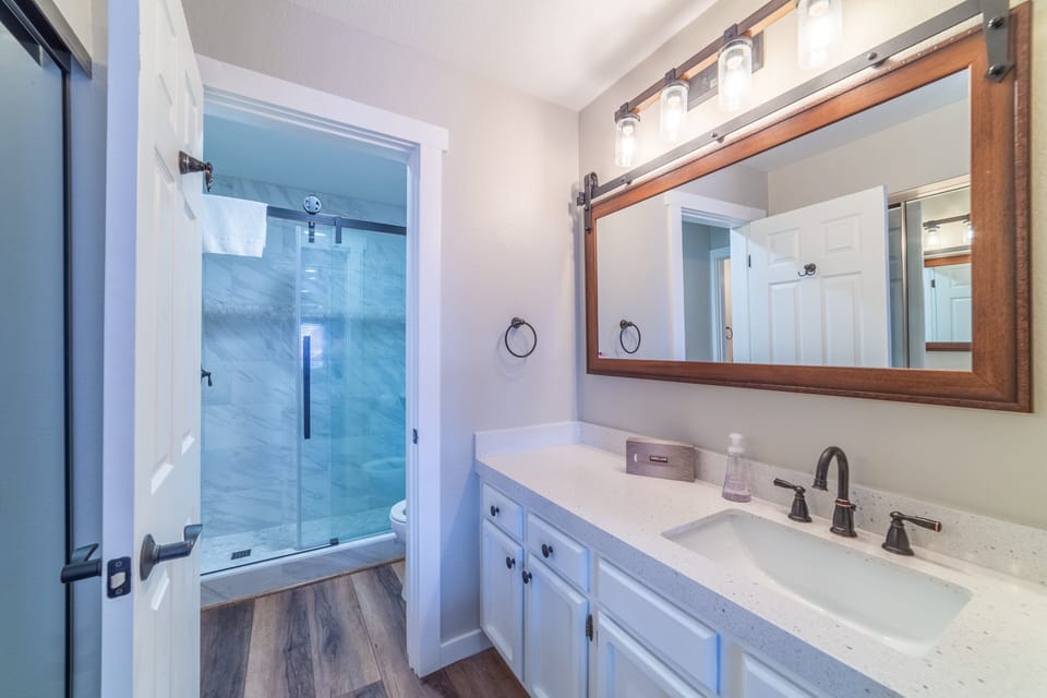 Remodeled primary bathroom w/ walk-in shower.