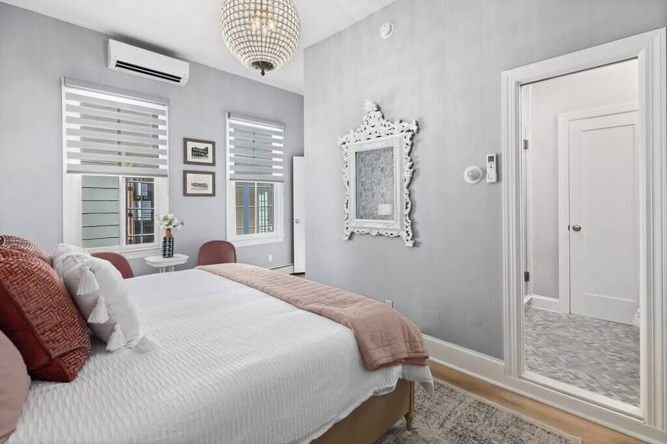 Master bedroom with king bed and room darkening shades