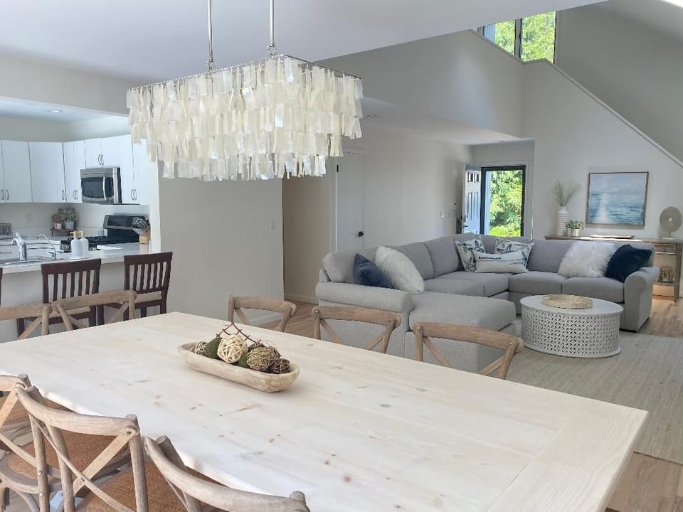 Custom 10 person dining table with open floor plan to living room & Kitchen